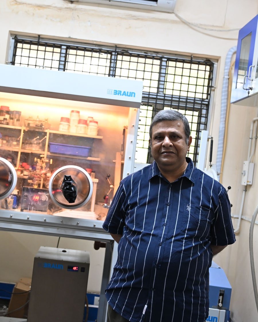 Prof. Debashis Chakraborty at the inert-atmosphere glovebox in the group laboratory